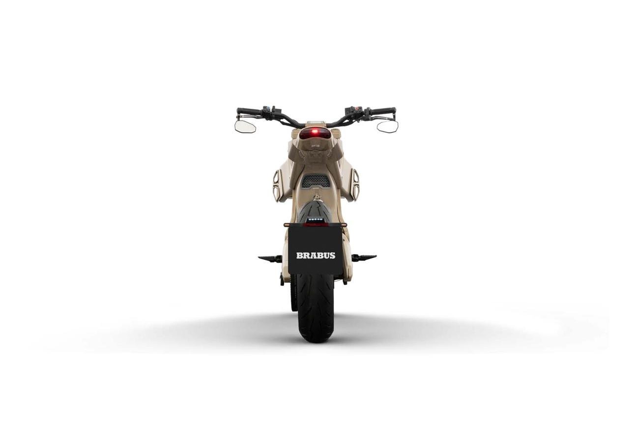 Brabus has unveiled an ultra-exclusive version of its Urban E electric motorcycle in collaboration with Japanese designer Hiroshi Fujiwara's Fragment Design. Called the Brabus Urban E Fragment Edition, the special model will be limited to just 10 units worldwide and carries a starting price of $50,000 in North America. The limited-edition electric motorcycle was developed alongside French electric motorcycle manufacturer DAB Motors. While the Fragment Edition retains the standard Urban E's core mechanical package, Brabus and Fragment have given it a dramatically different visual identity focused on a minimalist black-and-white theme. Only 10 Units Will Be Produced The biggest attraction of the new motorcycle is its extreme exclusivity. Brabus and Fragment Design are producing only 10 examples of the Urban E Fragment Edition. The motorcycle is priced at $50,000 in North America, while its European price is listed at €45,000. That makes it almost twice as expensive as the standard Urban E, which was introduced in Europe at €22,900. Rather than introducing major mechanical upgrades, Brabus has positioned the Fragment Edition as a collector-focused luxury motorcycle where design, exclusivity and branding are the primary selling points. Minimalist Black-and-White Design The Urban E Fragment Edition gets an unmistakable black-and-white appearance. Much of the bodywork is finished in black, while several components use exposed carbon fiber. These include the - Front fender - Rear hugger - Belly pan - Motor side cover - Rear winglets The motorcycle also features white carbon-fiber wheel covers, white Brembo brake calipers and a distinctive white Brabus Masterpiece leather seat. The seat features Brabus' signature Shell quilting pattern, adding a premium appearance to the otherwise minimalist design. One of the most interesting details is hidden inside the translucent rear LED taillight. The Fragment logo is integrated directly into the light, giving the motorcycle a subtle but recognizable connection to Hiroshi Fujiwara's design label. How Hiroshi Fujiwara Became Involved The collaboration reportedly started after Fujiwara encountered the Urban E during Milan Design Week. Fujiwara was impressed by the motorcycle's design and saw an opportunity to reinterpret it through the minimalist aesthetic associated with Fragment Design. According to the project description, Fujiwara liked the idea of taking an existing design and pushing it in a different direction—a philosophy that he felt was shared by both Fragment and Brabus. That chance encounter eventually developed into the limited-edition motorcycle now being presented as the Urban E Fragment Edition. 37 HP Electric Motor and 75 MPH Top Speed Despite its $50,000 price tag, the Fragment Edition retains the standard Urban E's powertrain. The electric motorcycle uses a brushless electric motor producing - Peak power 37 hp - Continuous power 8 kW - Claimed torque 350 lb-ft - Top speed 75 mph - Drive Carbon belt Brabus says the motorcycle features specially programmed engine management designed to improve throttle response. A dedicated inverter can deliver additional current to the motor under load. Carbon-fiber cooling ducts positioned on both sides of the motorcycle help direct air toward the motor, allowing it to maintain performance during hot weather and extended riding. 7.1 kWh Battery With Up to 93 Miles of City Range Power comes from a 72-volt, 7.1-kWh lithium-ion battery pack. Brabus quotes a maximum city range of approximately 93 miles, while the DAB Motors WMTC combined-cycle figure is around 75 miles. Charging times are listed at approximately Charging Level Approx. Time 50% → 100% 90 minutes 20% → 100% 3 hours 0% → 100% 3.5+ hours The charging port is positioned at the front of the motorcycle, while the charging cable can be stored in a compartment located ahead of the seat. Five Riding Modes Including Nitrous Boost The Urban E comes with multiple electronic riding modes designed for different situations. Sport Mode provides full power with a sharper throttle response for stronger acceleration. Street Mode also provides full power but uses a more linear torque delivery. Eco Mode limits the motorcycle's top speed to around 37 mph and softens the initial torque response to improve efficiency and reduce wheelspin. There is also a Reverse Mode, which uses electronic phase inversion to help maneuver the motorcycle in tight spaces. The most unusual feature is Nitrous Mode. Despite its name, this is an electronic boost function rather than conventional nitrous injection. It can provide maximum phase current to the motor for up to 10 seconds. Premium Brembo Brakes and Adjustable Suspension The motorcycle uses a steel double-cradle frame, steel trellis subframe and cast-aluminum swingarm. Suspension equipment includes - Fully adjustable 46mm inverted front fork - CNC-machined rear shock - Approximately 3.9 inches of suspension travel Braking hardware comes from Brembo. At the front is a 320mm floating disc with a white-painted four-piston radial-mount Brembo caliper. The rear uses a 240mm disc with a single-piston Brembo caliper. ABS is standard on both wheels. The standard Urban E weighs approximately 320 pounds, while its adjustable seat height ranges from 31.5 to 34.6 inches. Digital Features and Keyless Operation The Urban E Fragment Edition also receives modern electronic equipment. Instead of a conventional ignition key, the motorcycle uses a PIN-code starting system. A compact 2.8-inch LCD display provides information including - Speed - Battery level - Charging status - System temperature The motorcycle also features CNC-machined aluminum levers and brake-fluid reservoirs, integrated turn signals and a projector-style headlamp. Vertical daytime-running lights are positioned on either side of the monocoque-style tank and seat fairing. What Makes the $50,000 Price Different Mechanically, the Fragment Edition is largely the same motorcycle as the considerably cheaper standard Urban E. That means buyers are primarily paying for design, exclusivity and collectability. The key additions include the - Fragment Design collaboration - Black-and-white special finish - White Brabus Masterpiece leather seat - White Brembo calipers - White carbon-fiber wheel covers - Fragment-branded translucent taillight - Limited production of only 10 motorcycles Brabus is also releasing matching lifestyle products alongside the motorcycle, including leather riding gloves, a riding jacket and a fleece zip hoodie. The motorcycle is being unveiled at ComplexCon in Los Angeles, highlighting how Brabus is targeting the luxury fashion and streetwear audience as much as traditional motorcycle enthusiasts. Brabus Urban E Fragment Edition Key Specifications Specification Details Model Brabus Urban E Fragment Edition Production 10 units North American Price $50,000 European Price €45,000 Motor Brushless electric Peak Power 37 hp Continuous Power 8 kW Claimed Torque 350 lb-ft Top Speed 75 mph Battery 72V, 7.1 kWh City Range Up to 93 miles WMTC Range 75 miles Drive Carbon belt Front Brake 320mm Brembo Rear Brake 240mm Brembo ABS Standard Weight Approx. 320 lb Seat Height 31.5–34.6 inches Special Feature 10-unit Fragment Design edition